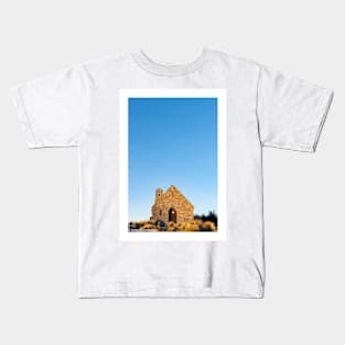 Sun sets on stone front of Church of Good Sheppard in Tekapo. Kids T-Shirt